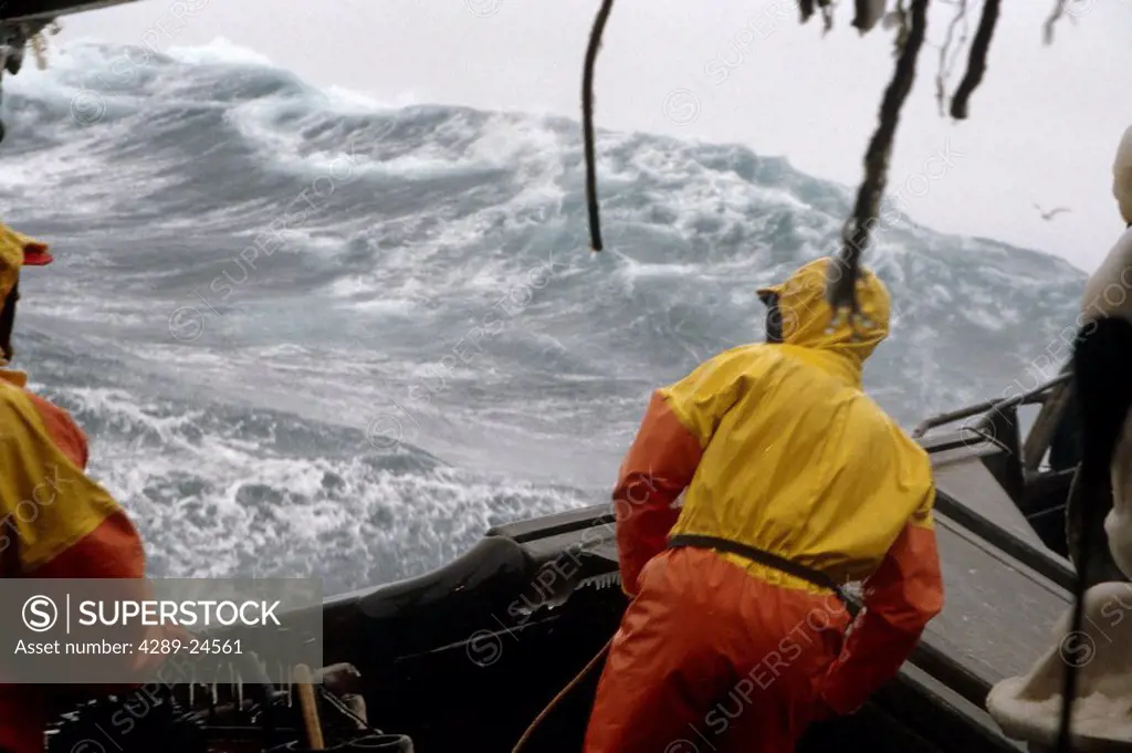 Fisherman Working on Deck High Winds Bering Sea SW AK /nOpilio Crab Season F/V Erla N