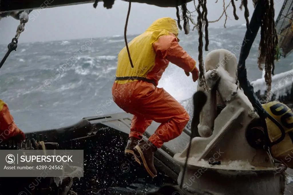 Fisherman Working on Deck High Winds Bering Sea SW AK /nOpilio Crab Season F/V Erla N