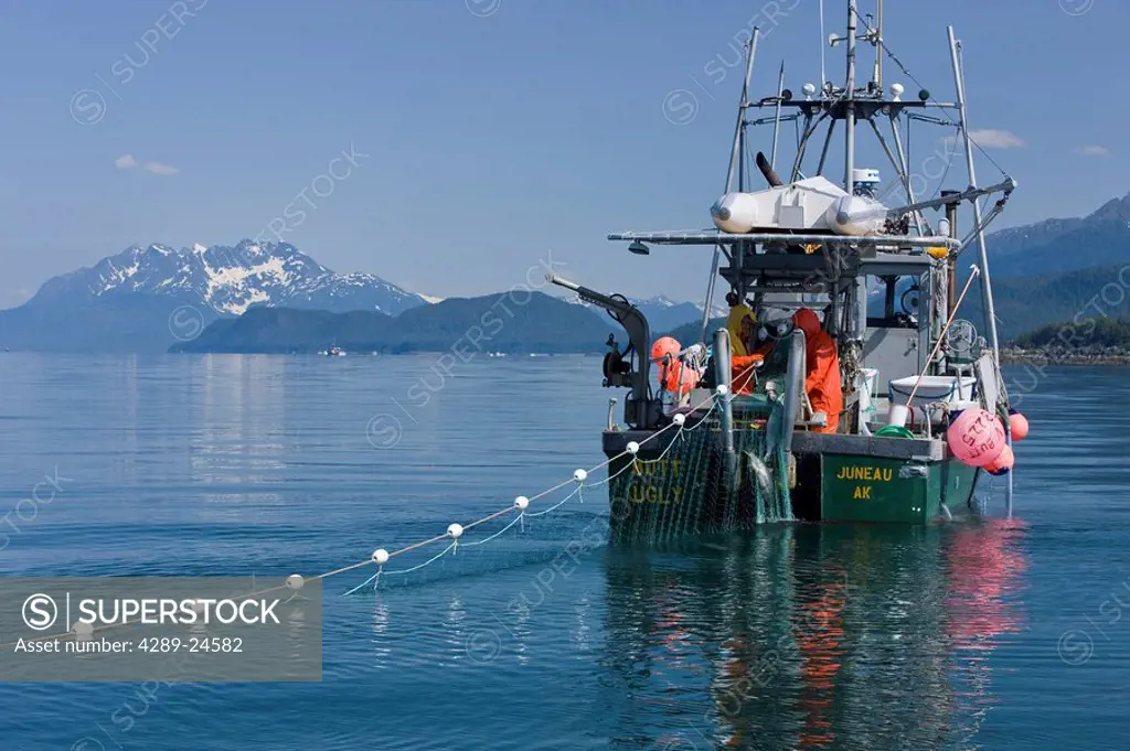 A commercial Gill Net fisher works the calm waters of Lynn Canal in Alaska´s Inside Passage, near Juneau.