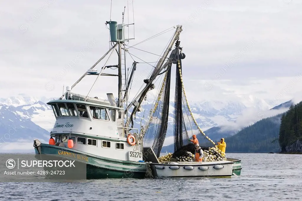 Commercial fishing seiner reeling in net summer Prince William Sound Alaska