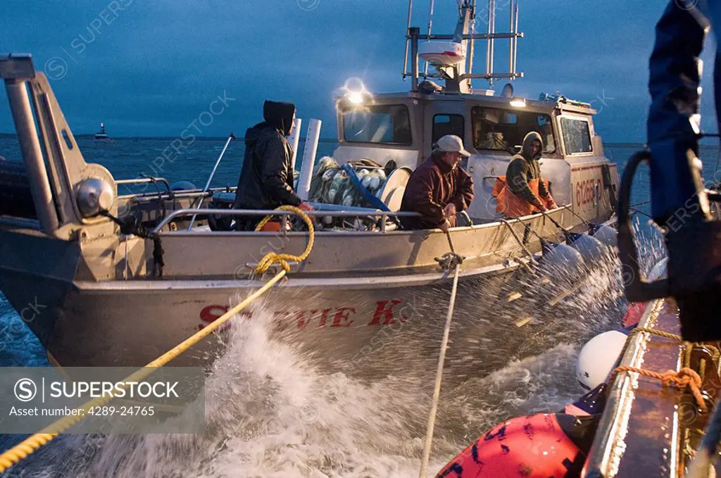 Crew of the F/V Stevie K tie up to a tender in rough seas in the Ugashik fishing district of Bristol Bay, Alaska/n