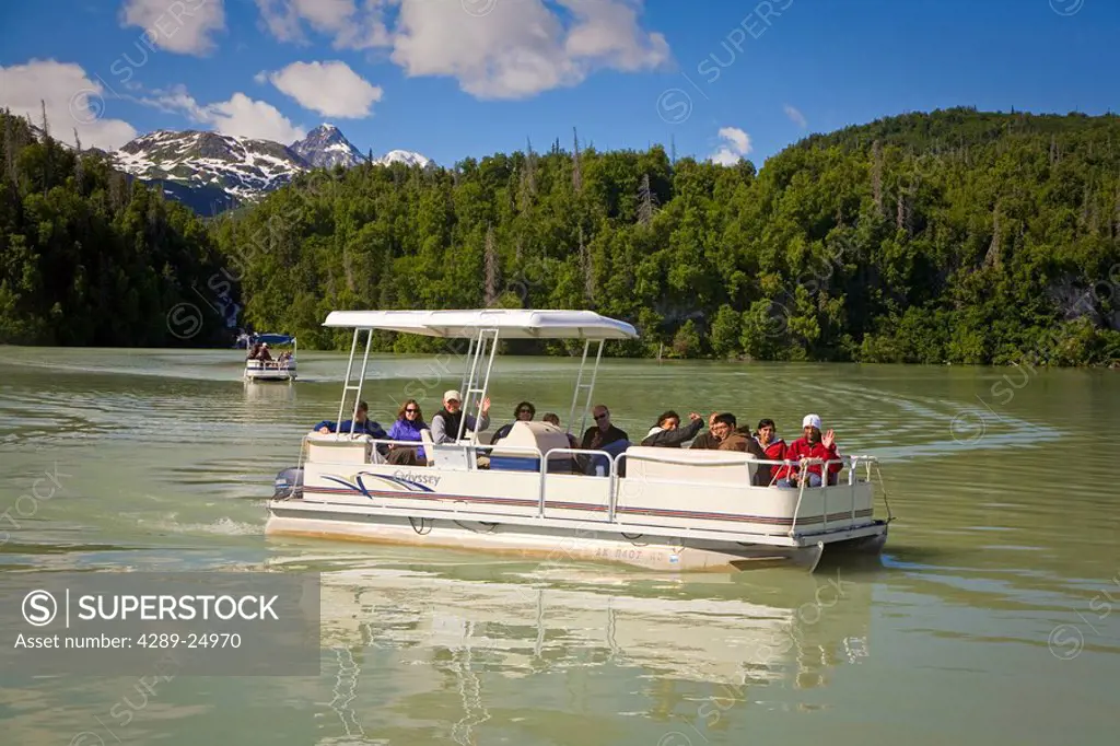 Guests of Redoubt Bay Lodge view Chigmit Mountains and scenery from pontoon boat on Big River Lakes in Redoubt Bay State Critical Habitat Area, Southc...