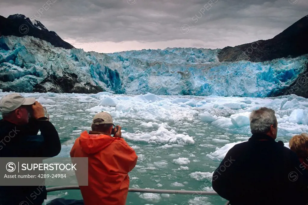 Visitors view South Sawyer Glacier from tour boat Tracy Arm Fords Terror Wilderness Area AK Summer