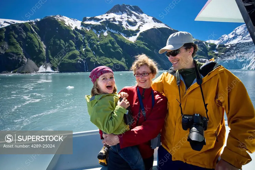 Famiily sight seeing in College Fjord from the deck of the Klondike Express tour boat, Prince William Sound, summer, South Central Alaska