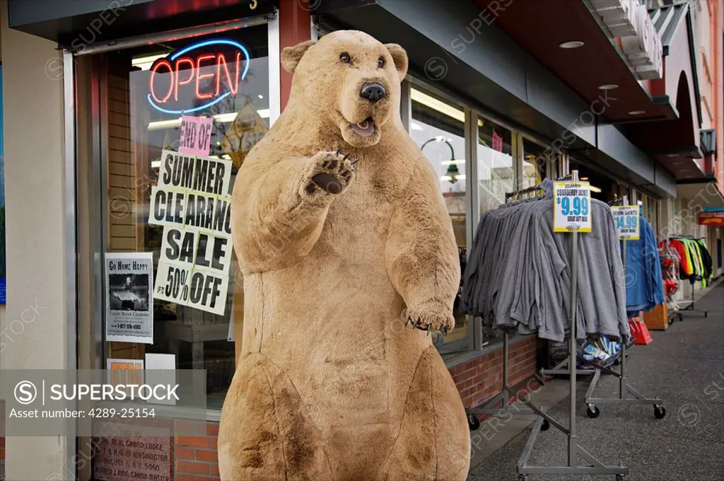 Retail business along an Anchorage street displays a large, fake stuffed bear