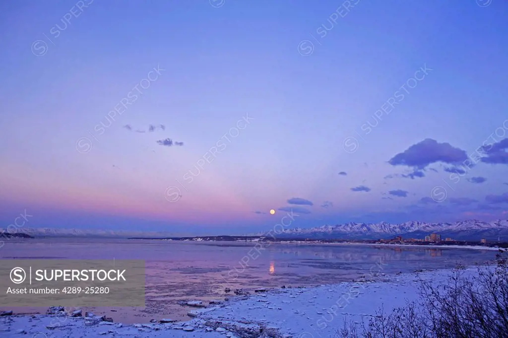 Sunset over Cook Inlet with full moon visible, Anchorage, SC, AK, Winter