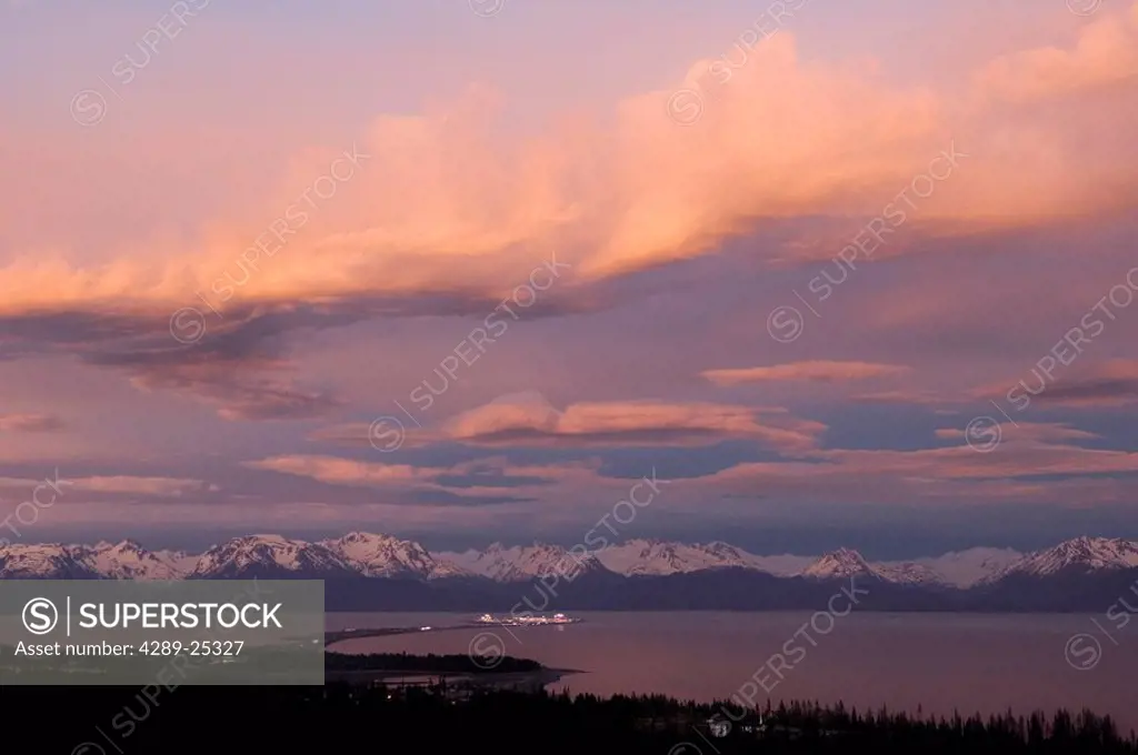 Cumulonimbus clouds over Kenai Mtns w/the lights of Homer Spit @ sunset Kenai Peninsula Summer Evening