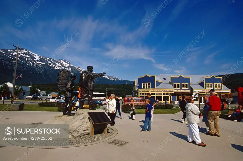 Visitors Gathered Around Chilkoot Trail Statue SE AK Skagway Summer