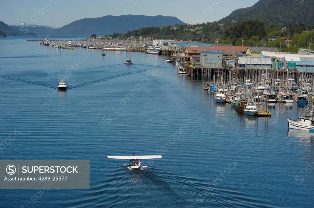 Boats and planes navigate the waterfront at Sitka, Alaska