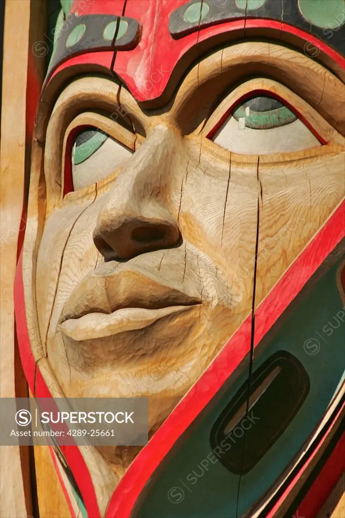 Close up of a face on a traditional Haida totem carving in Ketchikan, Alaska