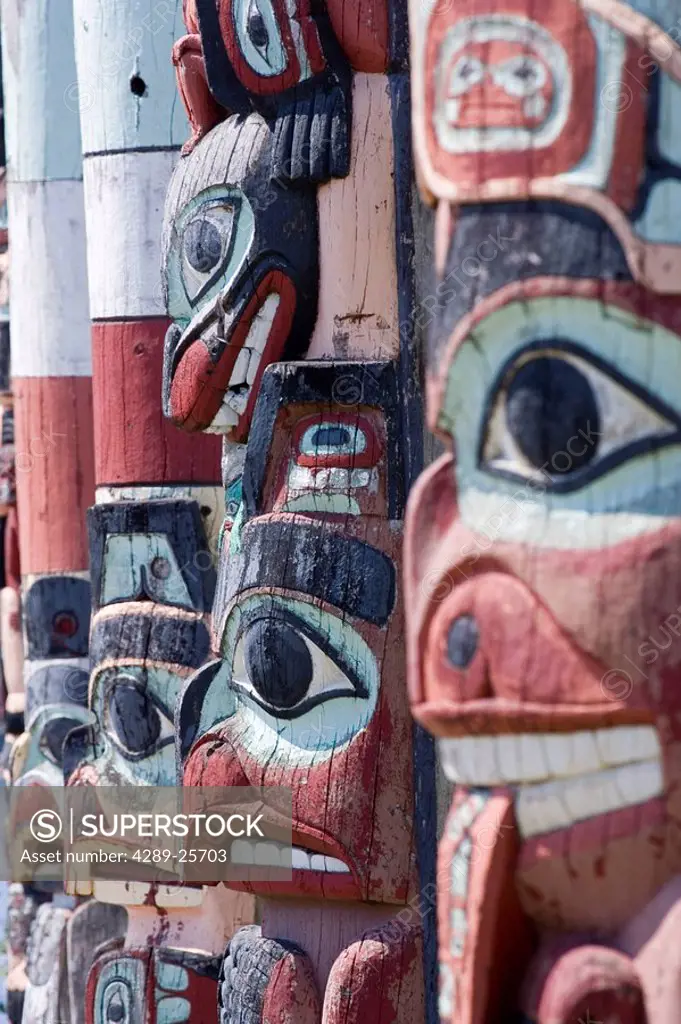 Line of totem poles in the community of Hydaburg Prince of Wales Isl Southeast Alaska Summer
