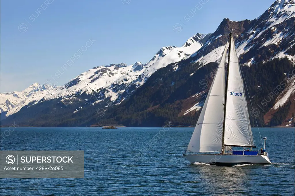 Small sailboat on pleasure cruise at Orca Inlet near Cordova Alaska Prince William Sound SouthCentral Summer