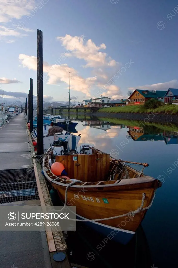 Classic wooden fishing boat in boat harbor Homer Spit early morning Kenai Peninsula Alaska Summer