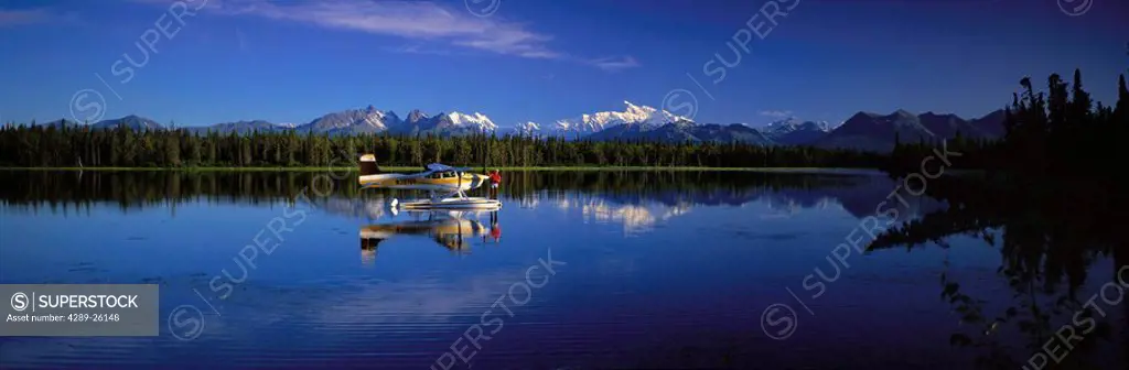 Man on Floatplane AK Range Lake Spin Fishing Summer AK Mt McKinley Southside Southcentral