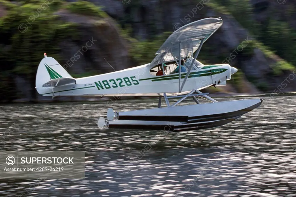 Supercub Floatplane Takes Off from Water AK Blurred Summer