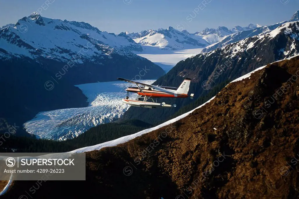 Helio_Courier floatplane flying over Mendenhall Valley w/Glacier Southeast AK Coast Mtns Tongass NF
