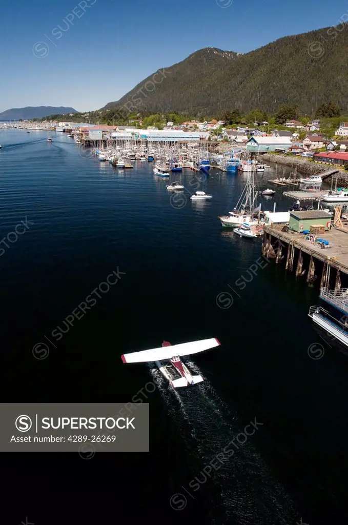 Overhead view of a float plane landing at the waterfront of Sitka, Alaska