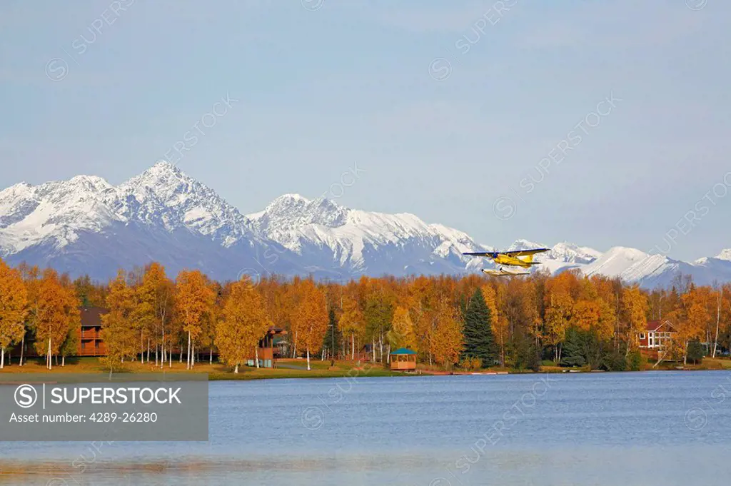 Float plane taking off from Lake Lucille in Wasilla, SC, Alaska