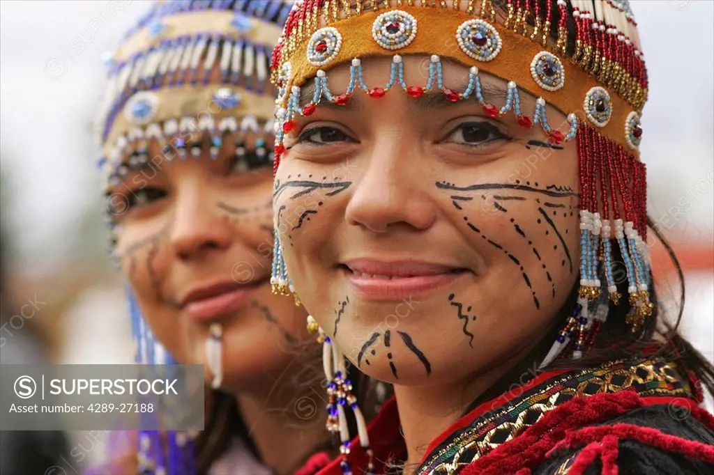 Native performers with traditional Alutiiq headdresses and facial tattoos at the Alaska State Fair in Palmer. Summer in Southcentral Alaska