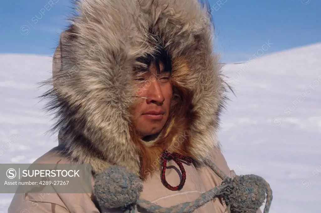 Portrait of Inupiat Eskimo man in Wolf ruff Parka Buckland Alaska Western Spring