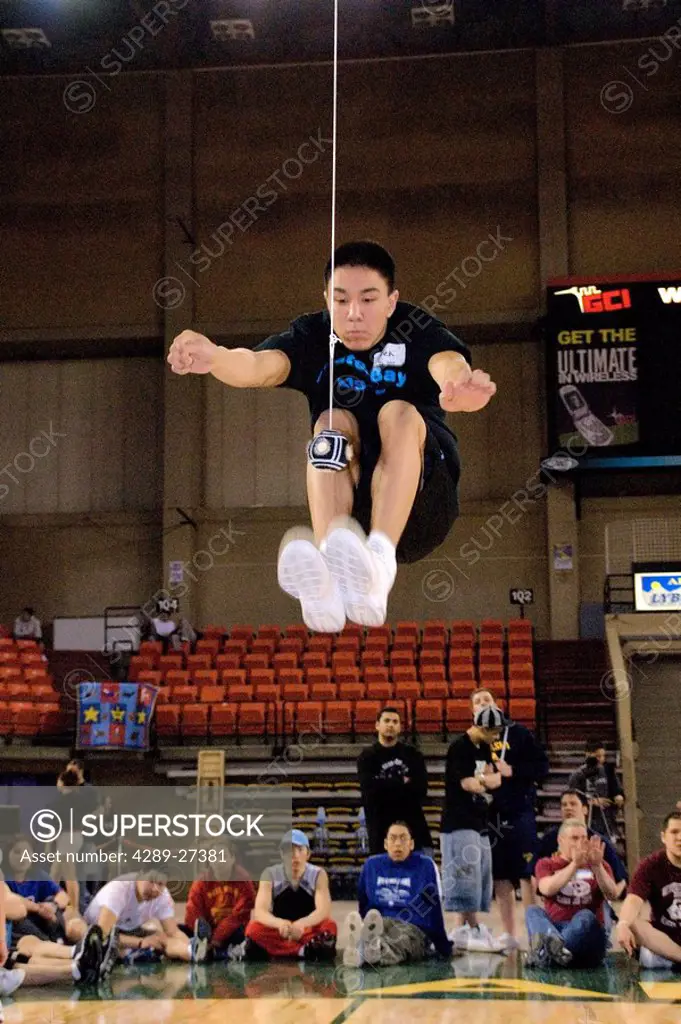 Boy doing Two_Foot High Kick 2006 Senior Native Youth Olympic Games Alaska Anchorage Sullivan Arena