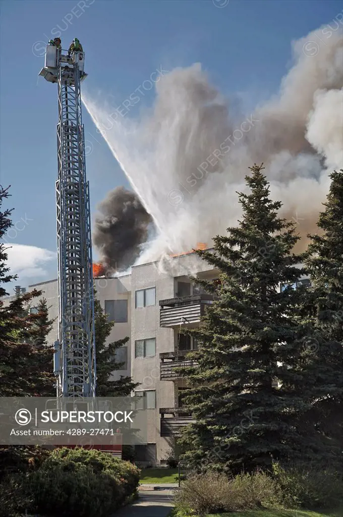 Anchorage Fire Department putting out a fire on a building, Alaska