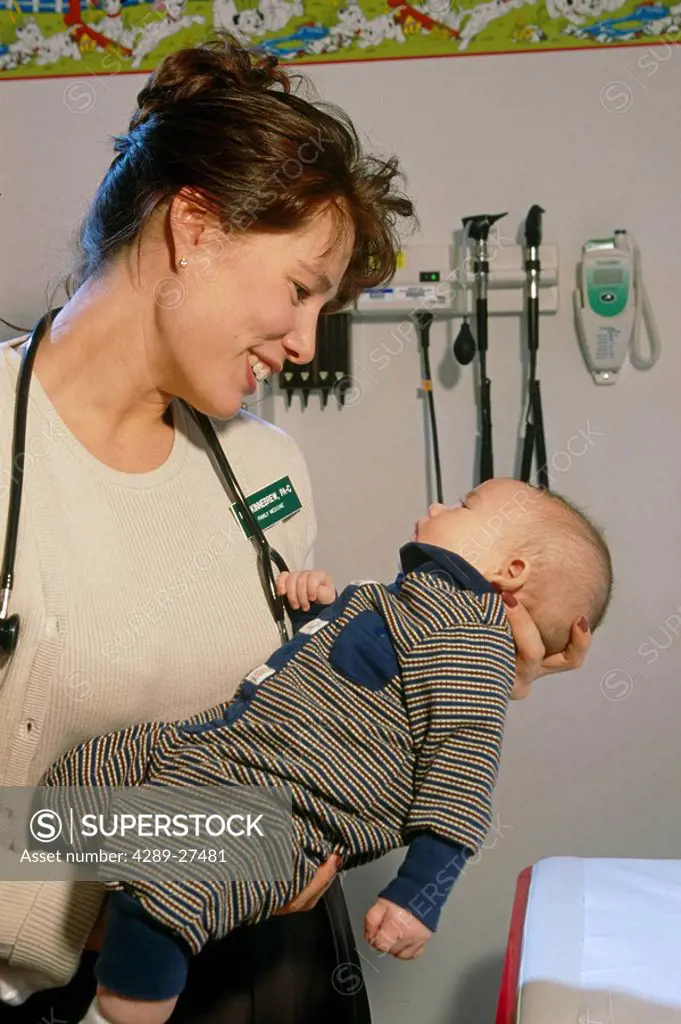 Female Doctor W/Native Baby Boy at Health Clinic SC AK/n