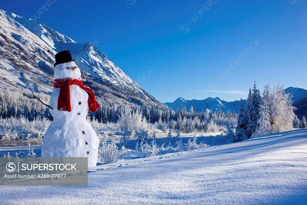 Snowman with a top hat and scarf in the Chugach Mountains,/nSouthcentral Alaska, Winter, COMPOSITE