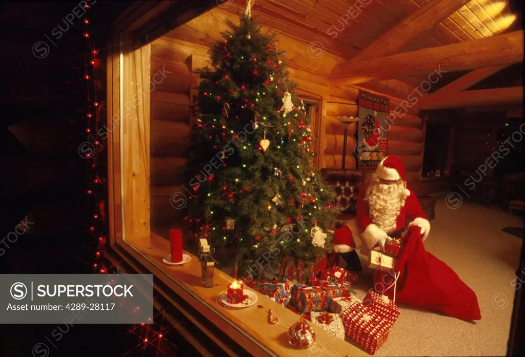 Santa Claus Giving Presents Christmas Tree Girdwood AK Southcentral Winter Cabin