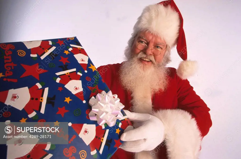 Portrait of Santa Claus With Christmas Present