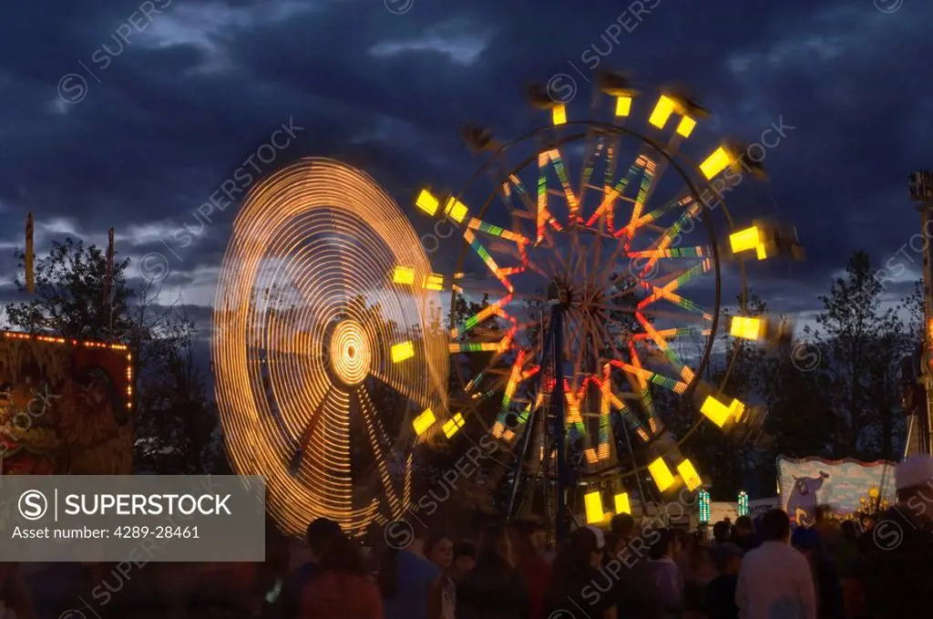 Alaska State Fair nighttime Ferris Wheel crowd of people wait in line Palmer Alaska Southcentral