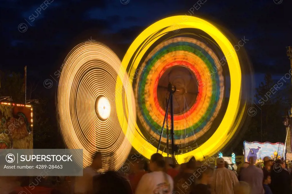 Alaska State Fair crowd of people wait in line to go on rides time exposure Palmer Alaska Southcentral