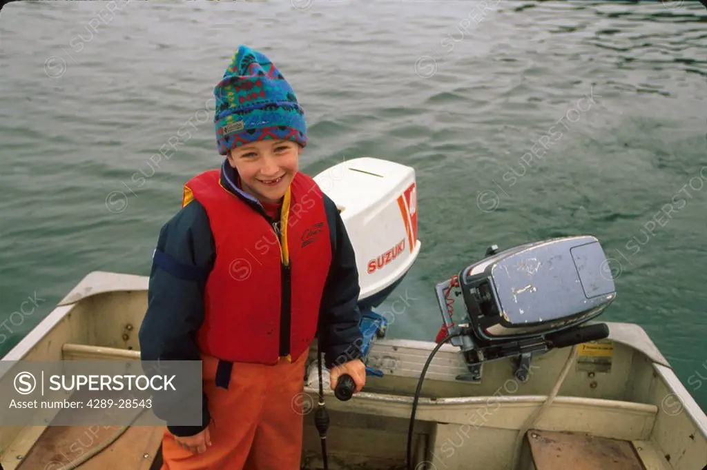 8_year_old Boy Driving Skiff Juneau Southeast AK summer portrait