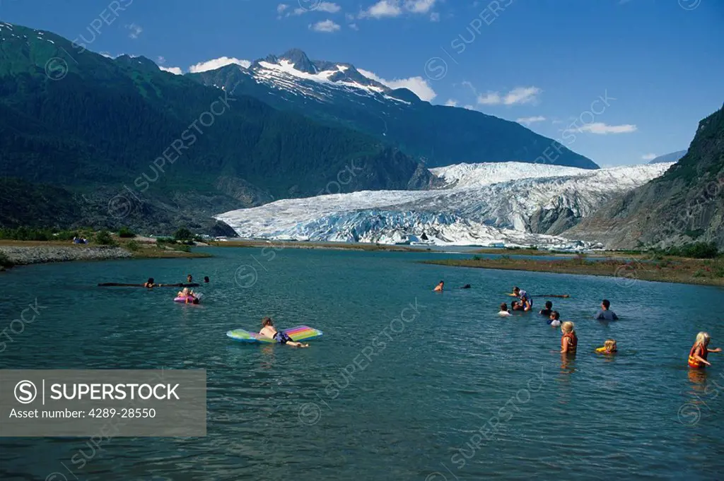Alaskan children swimming in Mendenhall Lake w/Glacier Juneau Alaska Southeast Summer Tongass NF