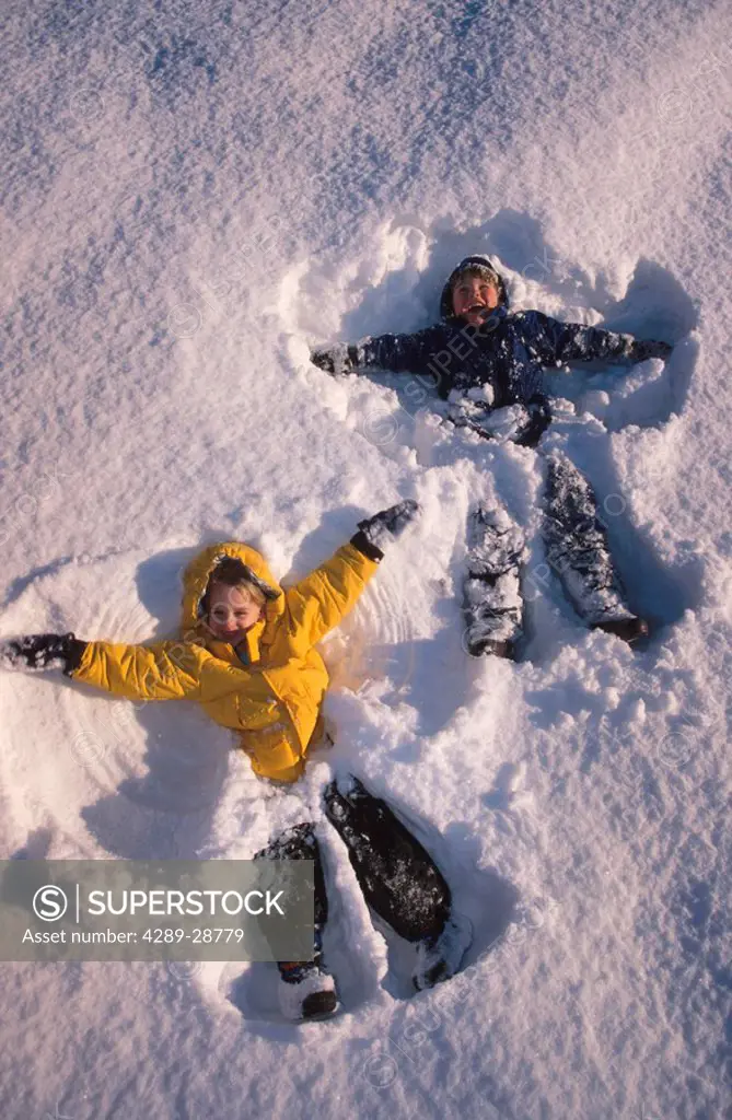 Kids make snow angels Russian Jack Park Anchorage SC AK winter aerial