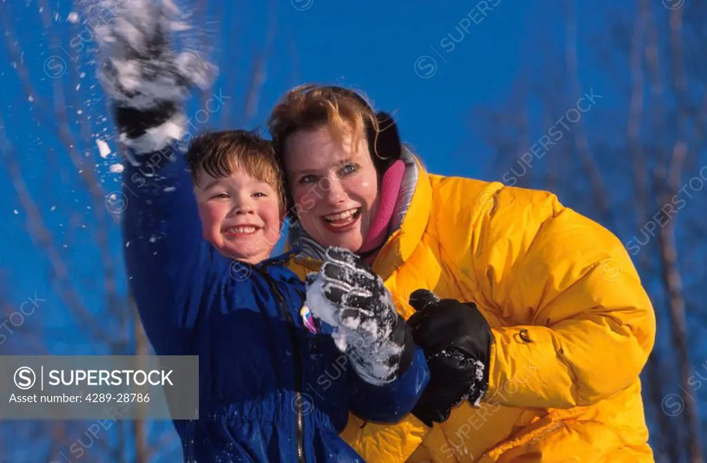 Mother & Son playing in snow Russian Jack Park Anchorage SC AK winter portrait