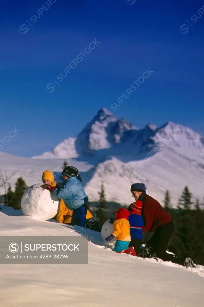 Family Making Snowman Russian Jack Park Winter AK SC