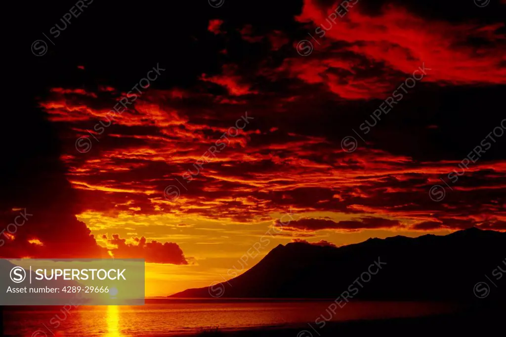 View of Turnagain Arm at sunset with Bird Point and Bird Ridge in the distance,/nSouthcentral Alaska, Fall