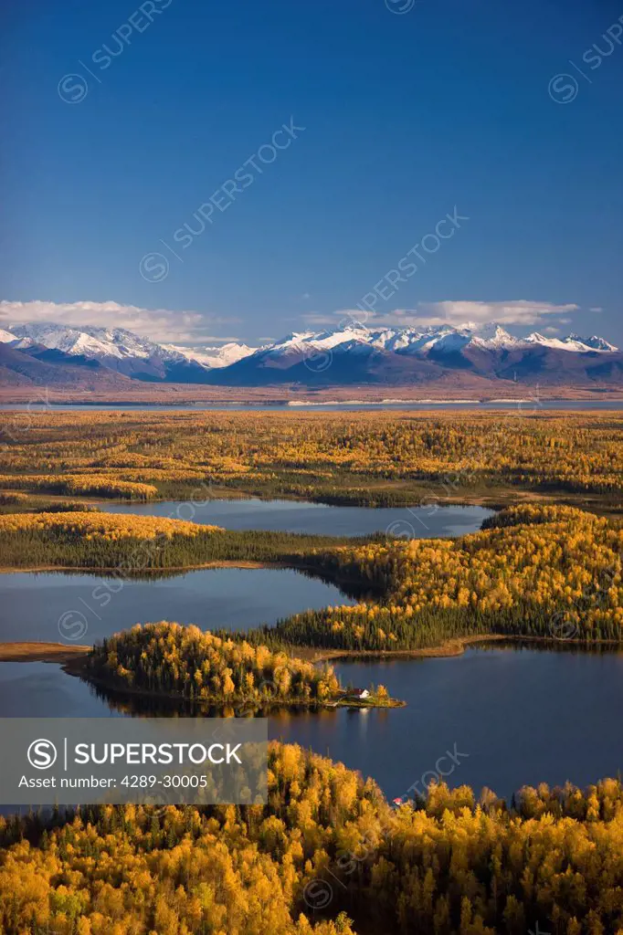 Aerial View of the lakes and Birch forests at Point Mackenzie on the opposite side of Knik Arm from Anchorage with the Chugach Mountains in the backgr...