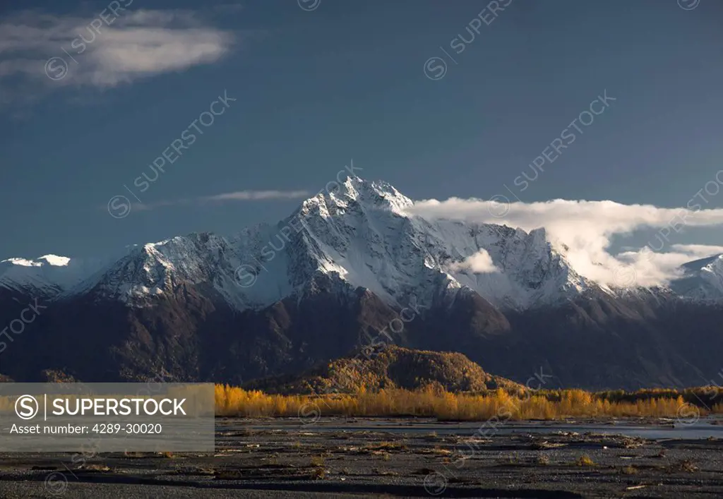 Scenic view of Pioneer Peak with Knik River in the foreground during Autumn, Southcentral Alaska