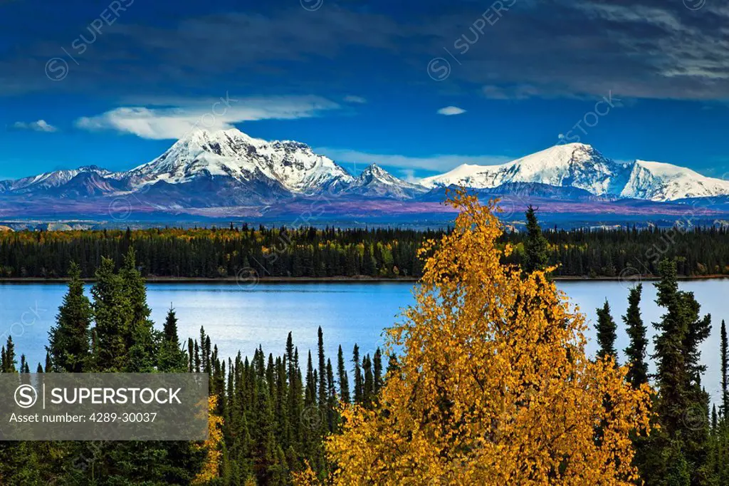Scenic view of Mt. Sanford L and Mt. Drum R with Willow Lake in the foreground, Wrangell St. Elias National Park & Preserve, Southcentral Alaska, Autu...