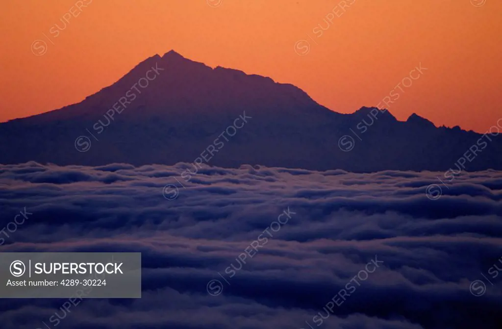 Mt.Redoubt Silhouetted at Sunset Fog Filled Cook Inlet