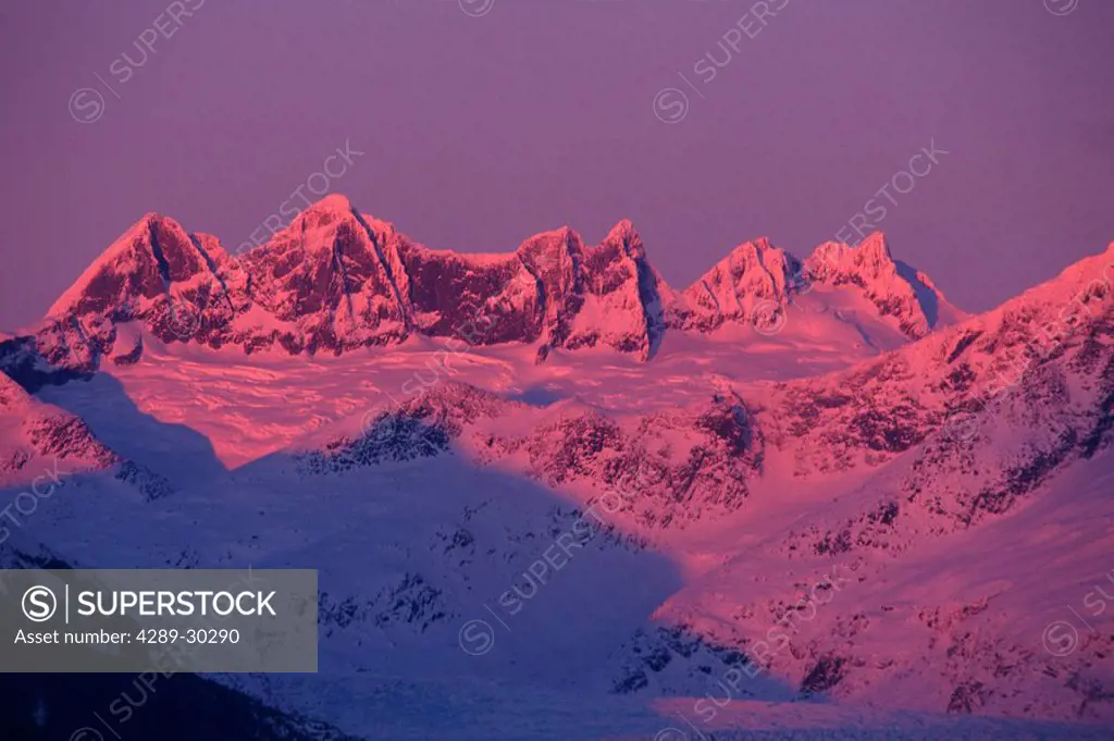 Alpenglow lights up Mendenhall Towers above the glacier @ sunrise Coast Mtns Southeast Alaska Winter