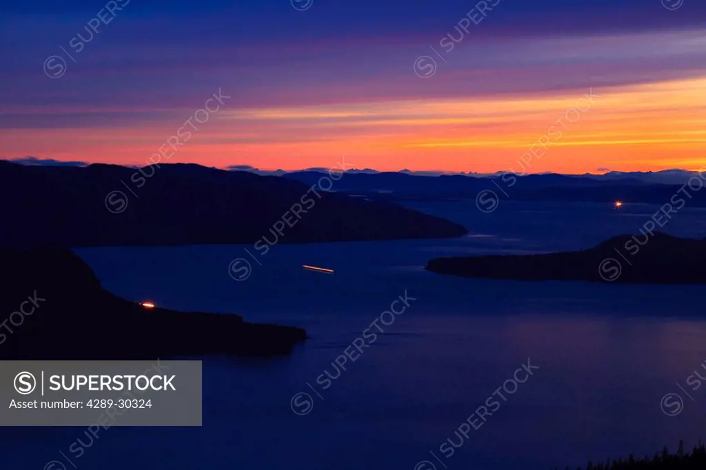 View from Wrangell Island of Alaska Marine Highway Ferry in Zimovia Strait at sunset, with Sumner Strait in the background, Fall, Southeast Alaska