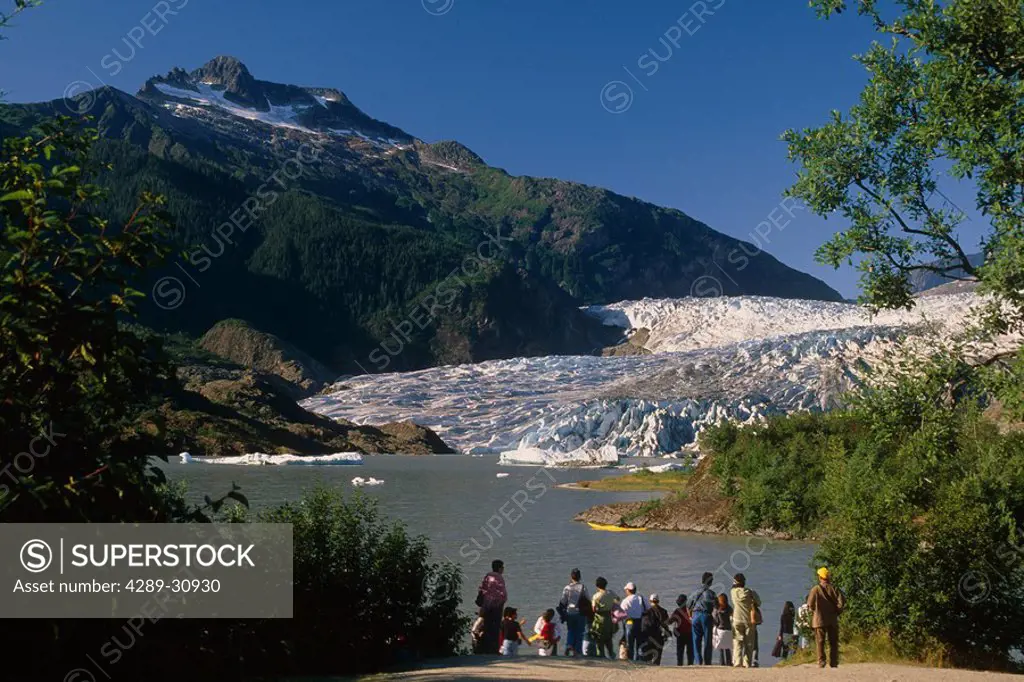 Visitors viewing Mendenhall Glacier from shoreline of Lake Southeast Alaska Summer Tongass Nat Forest