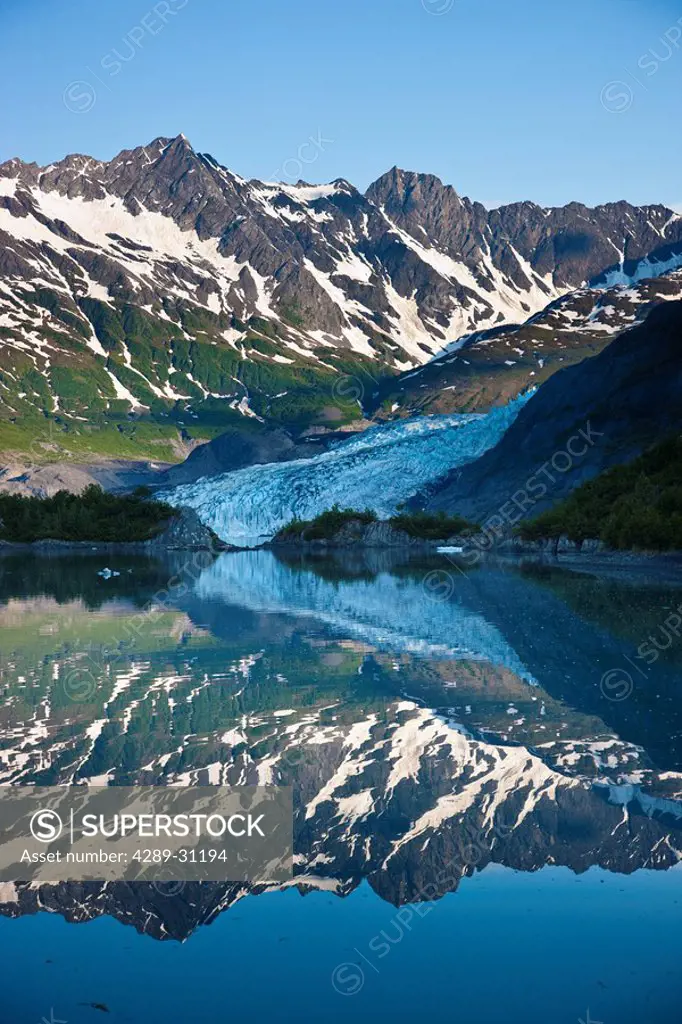 Shoup Glacier reflected in the water, early morning, Shoup Bay State Marine Park, Prince William Sound, Valdez, Southcentral Alaska, USA.