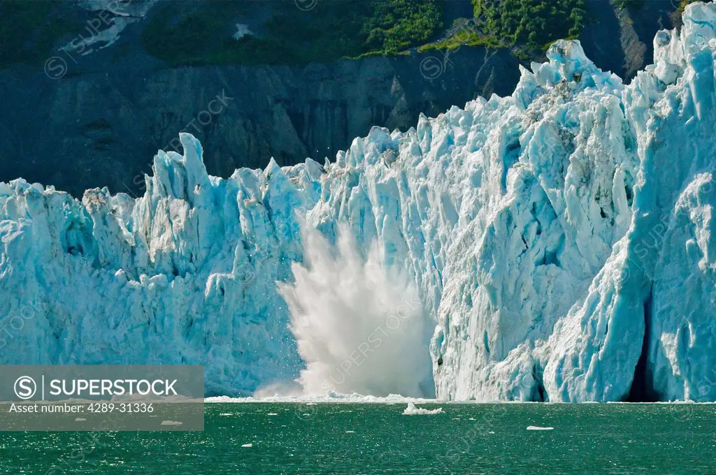 Ice calving off the face of Barry Glacier in Prince William Sound, Southcentral Alaska, Summer