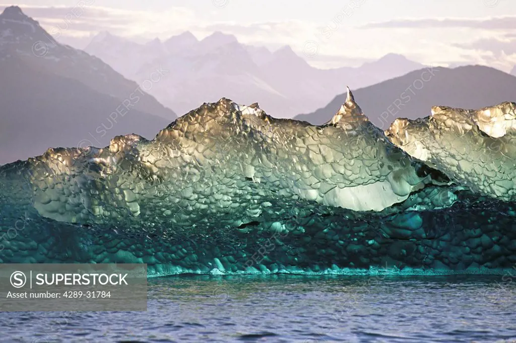Columbia Glacier ice berg that broke loose from the ocean bottom of over 1,000 feet deep, which gives the berg a clear appearance, Prince William Soun...