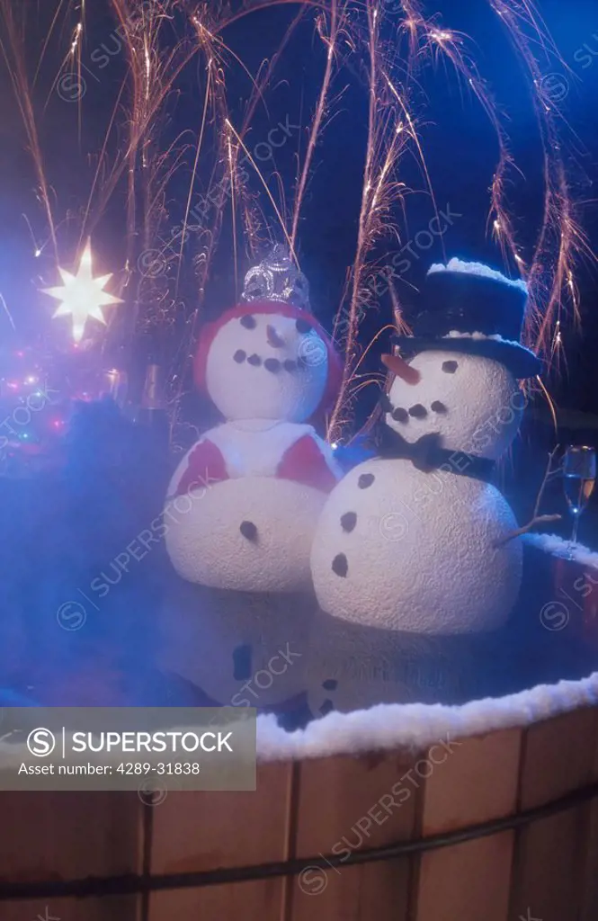 Two Snowpeople Sitting in a Hot Tub Celebrating Holidays