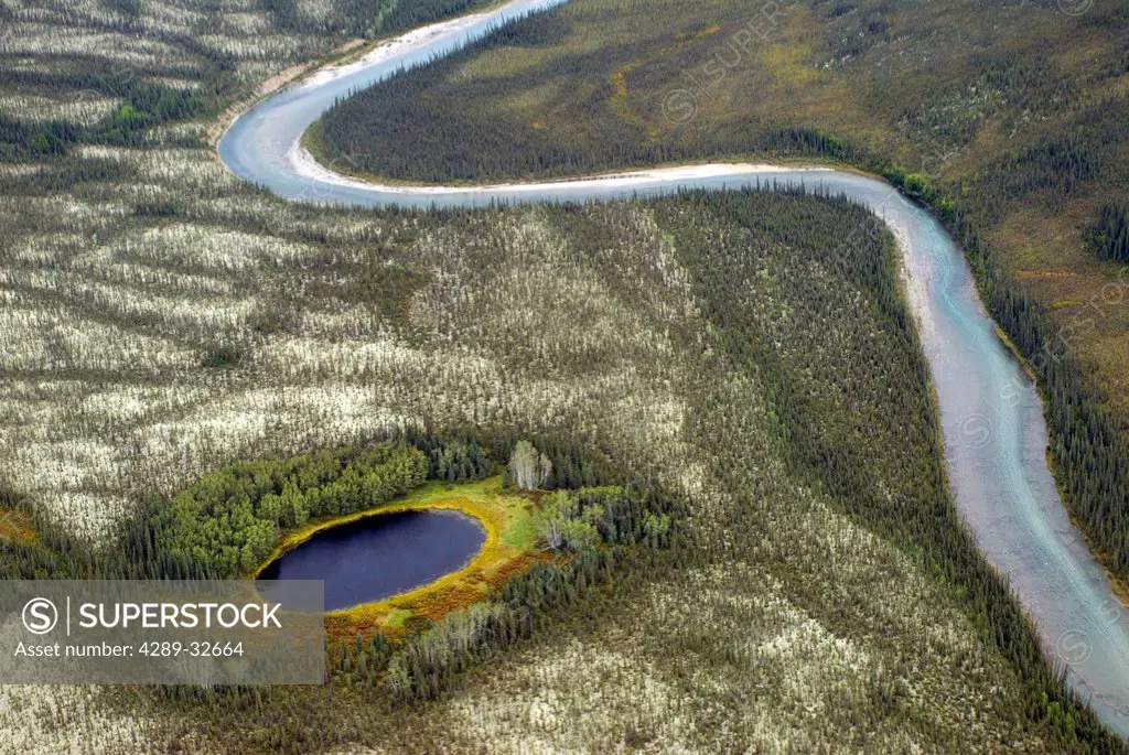 Aerial view of a stream meandering through the foothills of the Brooks Range, Gates of the Arctic National Park & Preserve, Arctic Alaska, Fall